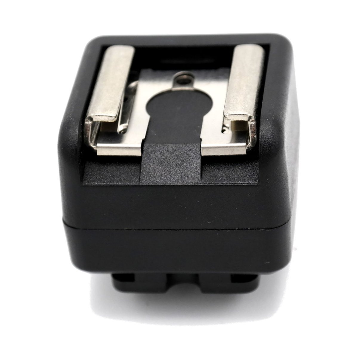 Caruba Blitzschuh-Adapter - (Mittelkontakt auf X-Kontakt) - Draufsicht auf Blitzschuhadapter Caruba Blitzschuh-Adapter - (Mittelkontakt auf X-Kontakt) - Draufsicht auf Blitzschuhadapter