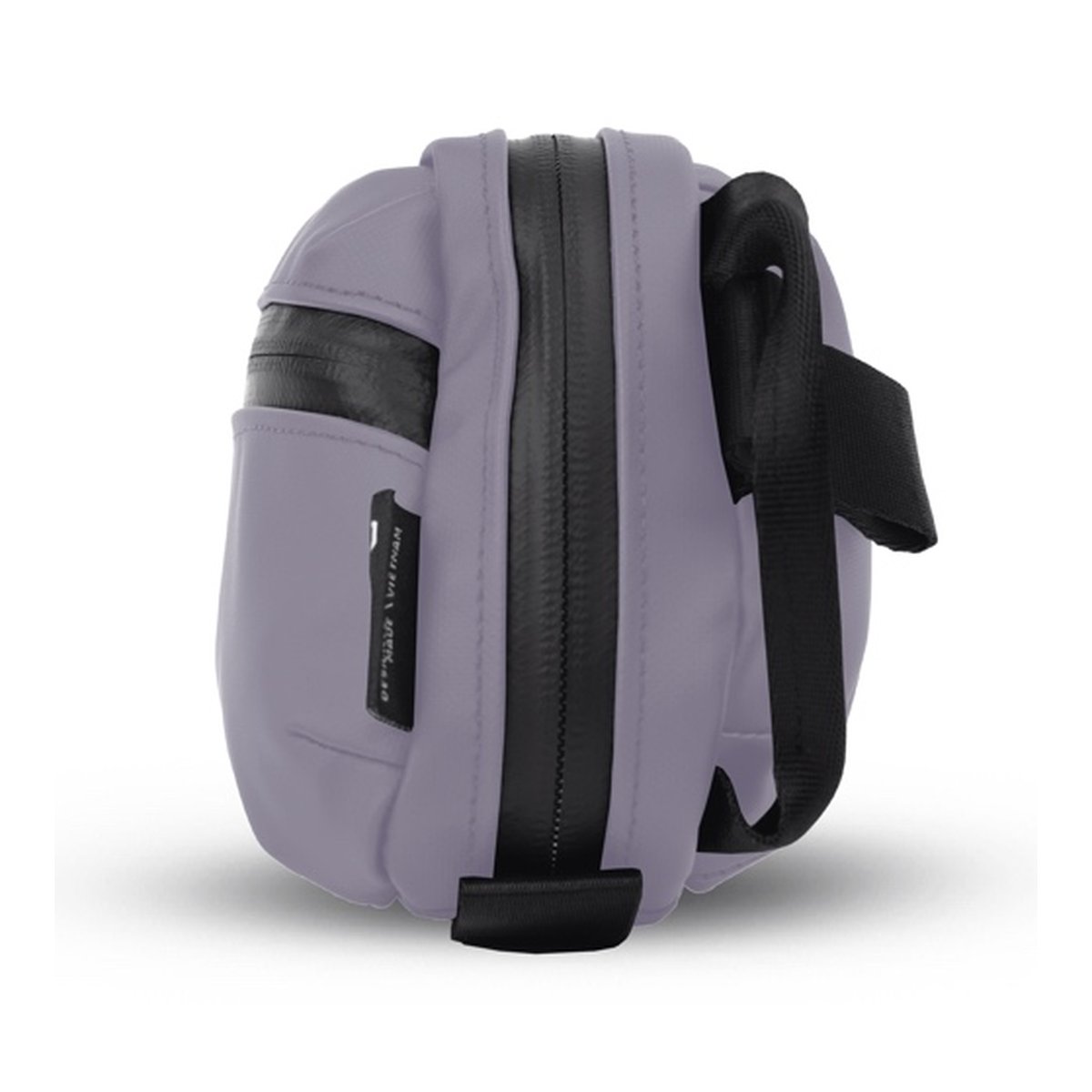 WANDRD Tech Bag Medium Uyuni Purple - Seitenansicht der lila-grauen Tasche mit schwarzem Reißverschluss und Gurt.