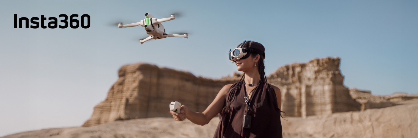 Insta360 Antigravity A1 360-Grad Drohne fliegt über Landschaft, Pilotin mit FPV-Brille