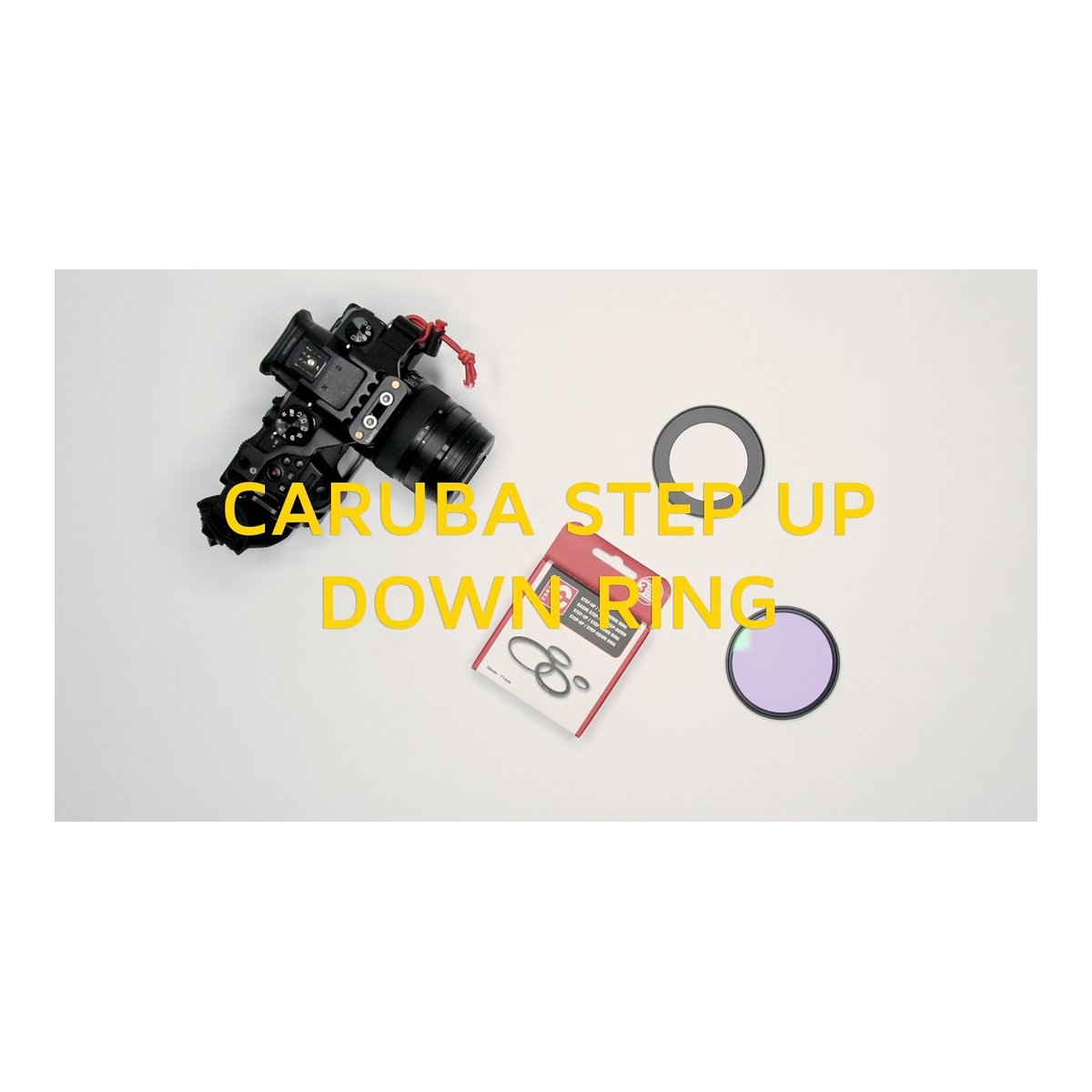Caruba Step-up/down Ring 62mm - 72mm - Anwendungsbeispiel: Caruba Step-Up/Down-Ring Set mit Kamera und Filter auf weißem Hintergrund.