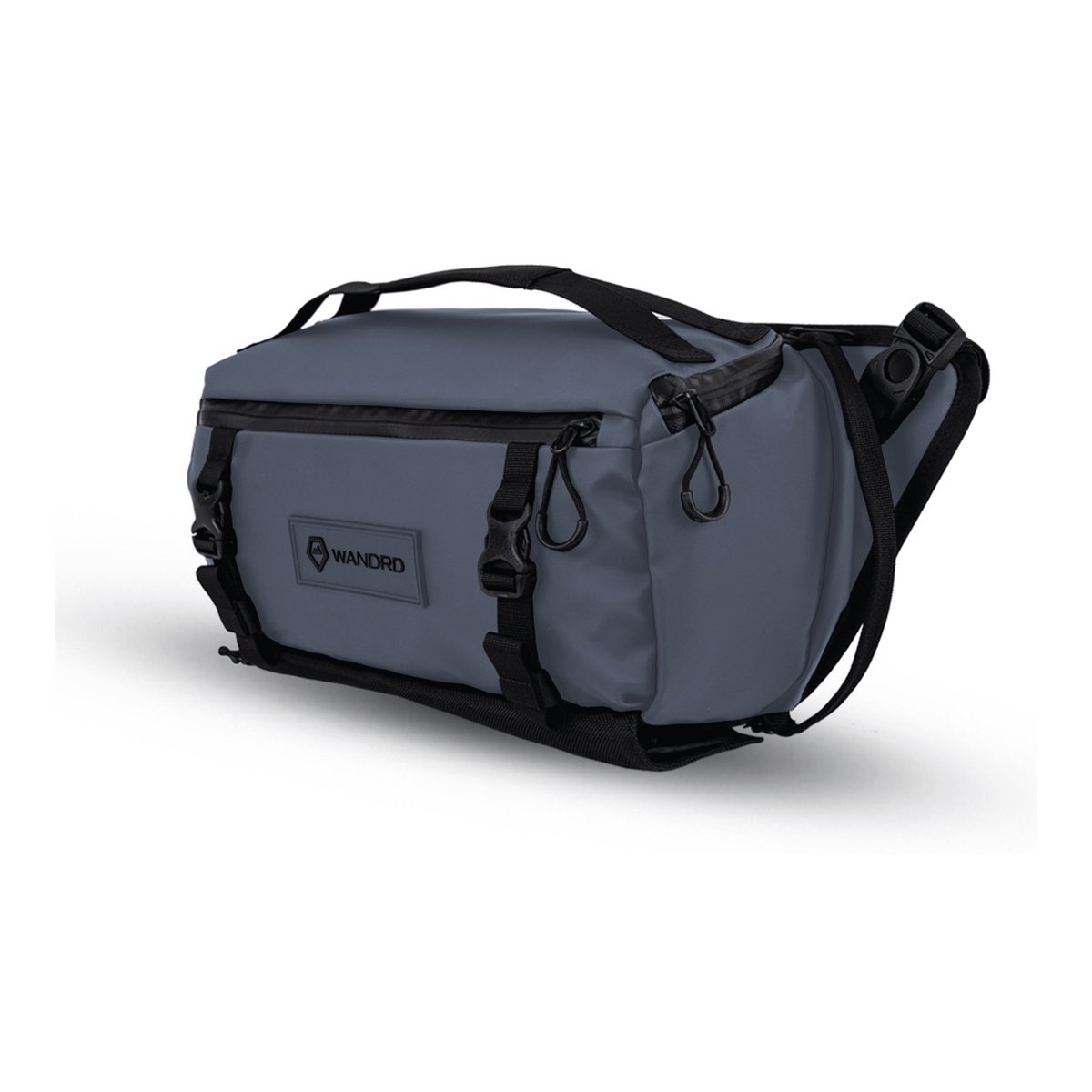 WANDRD ROGUE Sling 9L Aegean Blue - Graue Bauchtasche/Slingbag: Schräge Frontansicht mit Wandrd-Logo und Riemen. WANDRD ROGUE Sling 9L Aegean Blue - Graue Bauchtasche/Slingbag: Schräge Frontansicht mit Wandrd-Logo und Riemen.